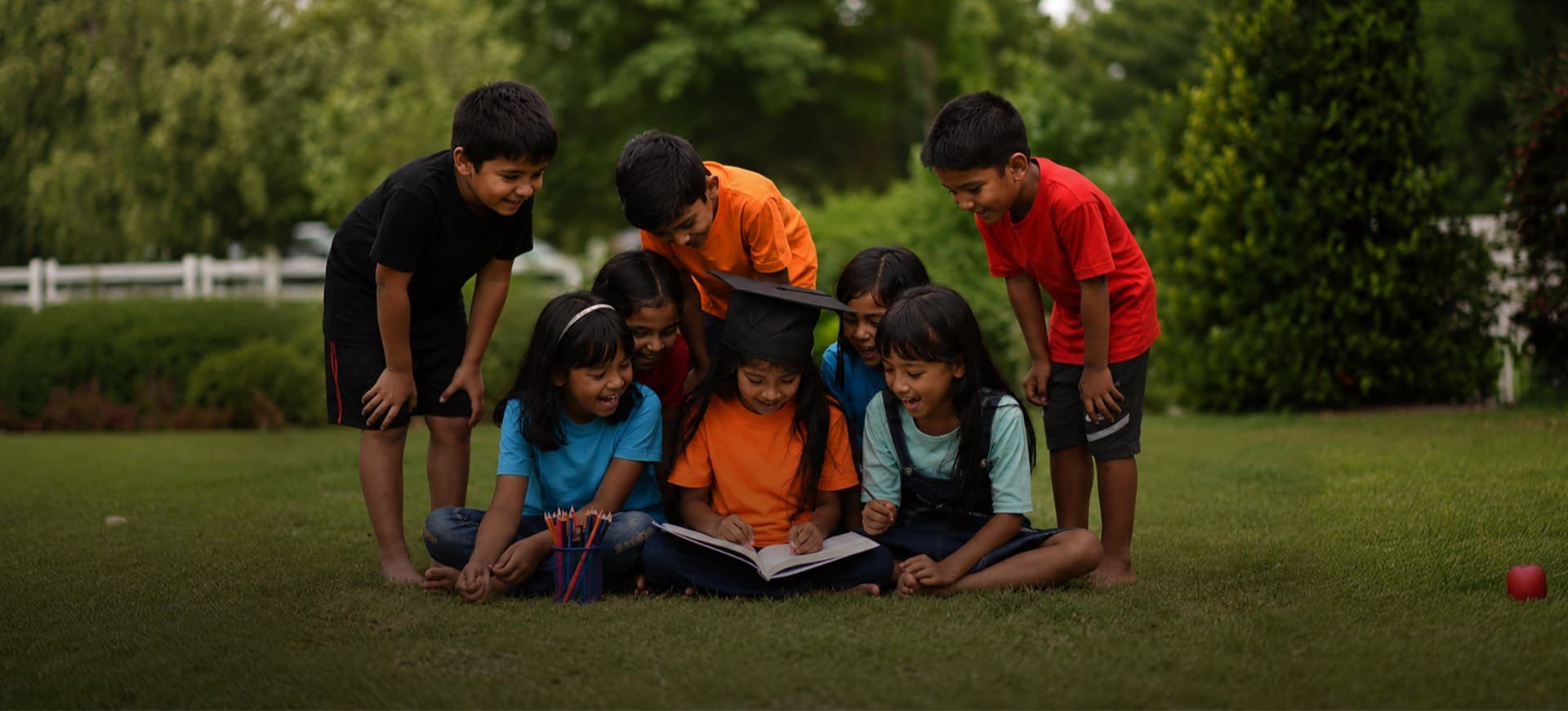 Children gathered together, reading